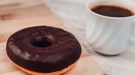 Chocolate glazed donut & cut of coffee