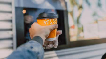 Receiving coffee at a drive thru