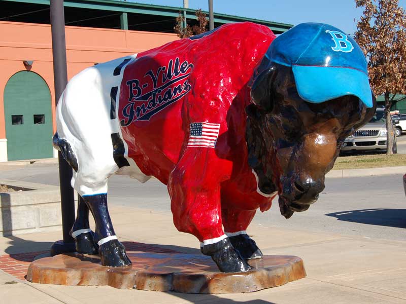 Painted buffalo sculpture with baseball cap and jersey. "B-ville Indians" written on it.