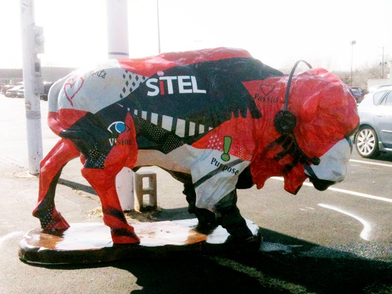 Sit(el)ing Bull Painted buffalo sculpture wearing headphones