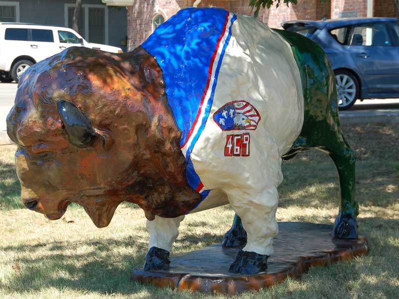 Patch Painted buffalo sculpture with Boy Scout troop 469 uniform and patch.