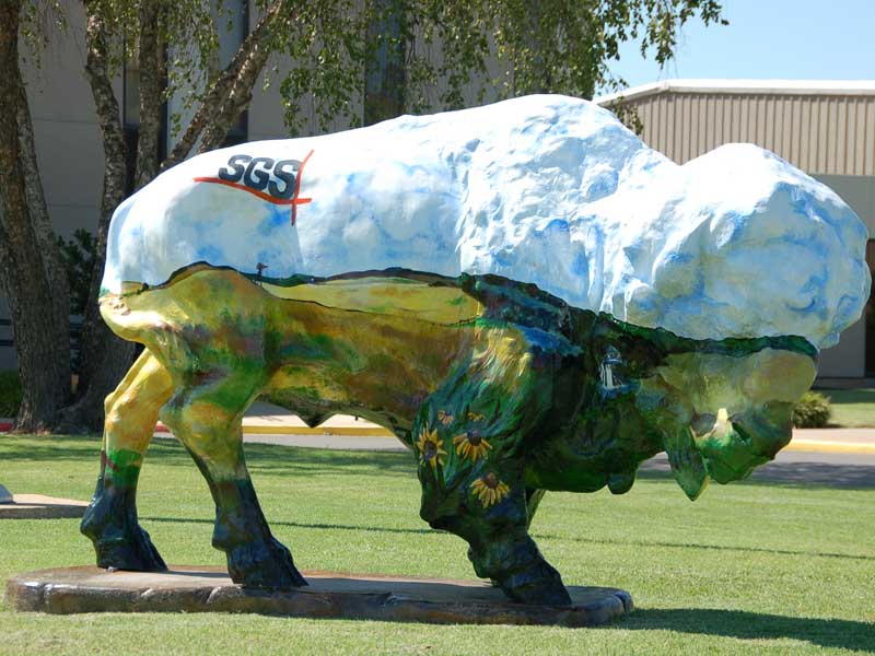 SGS Bison Buffalo sculpture painted with prairie landscape and SGS logo