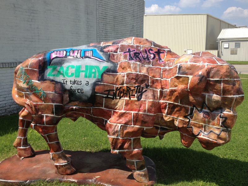 Zachry Buffalo Painted buffalo sculpture with brick camouflage