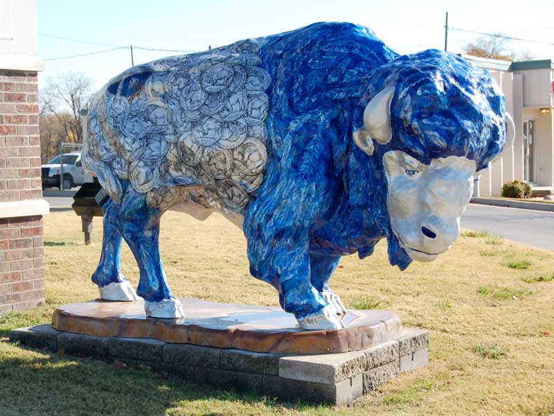 Nickelangelo Blue painted buffalo sculpture with silver nickels covering body