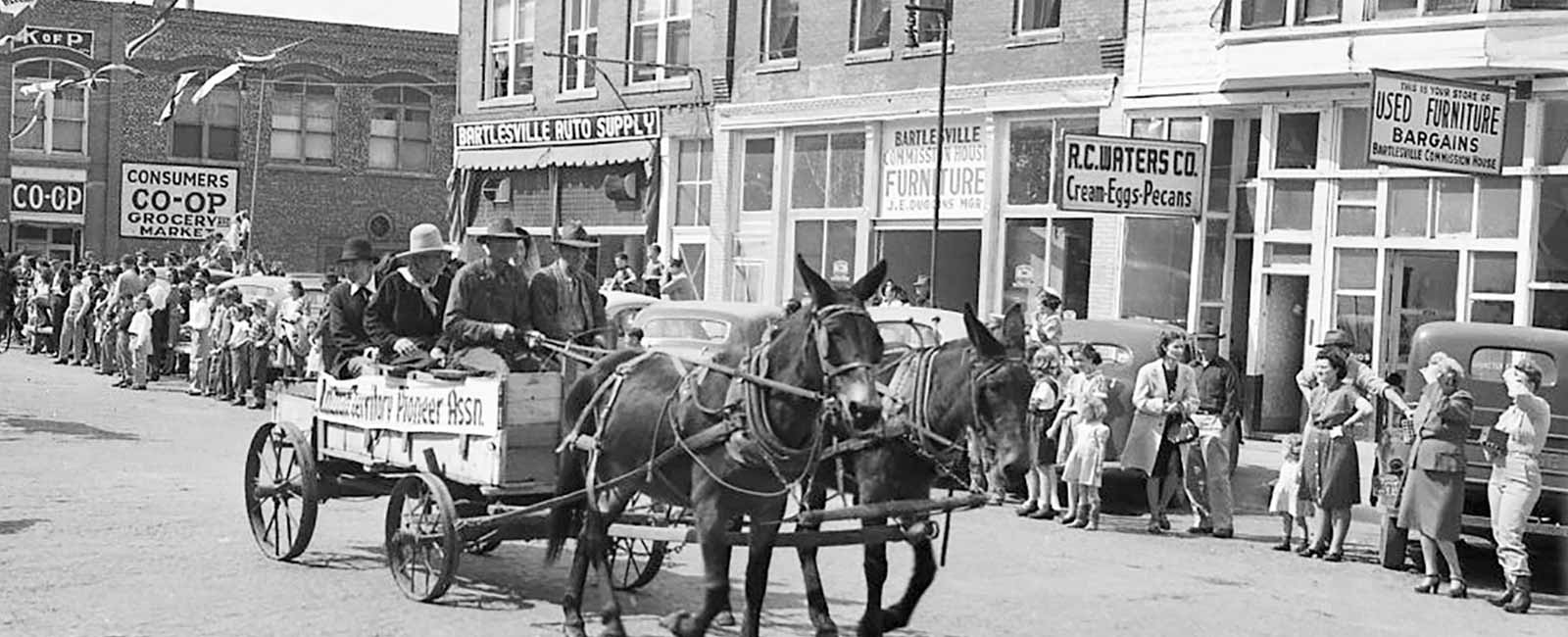 Black and white photo from mid-nineteenth century of parade in Bartlesville