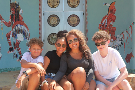 Family photo at entrance to Woolaroc Museum